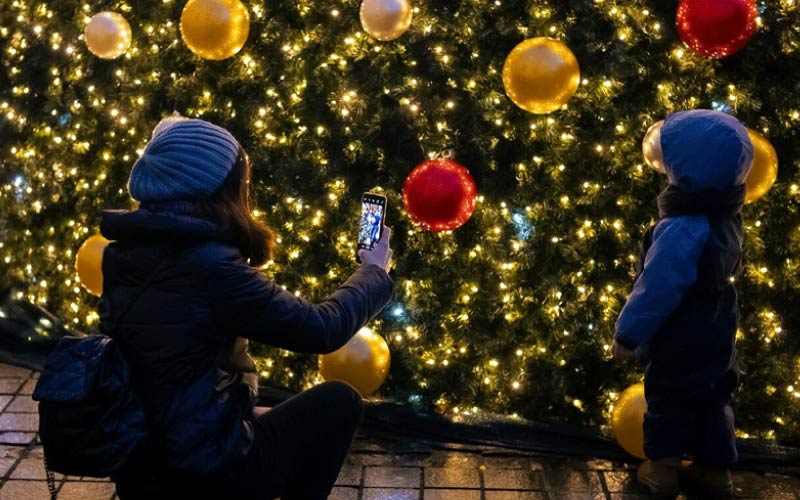 family in festive street scene, Birmingham holiday, October 2024, UK