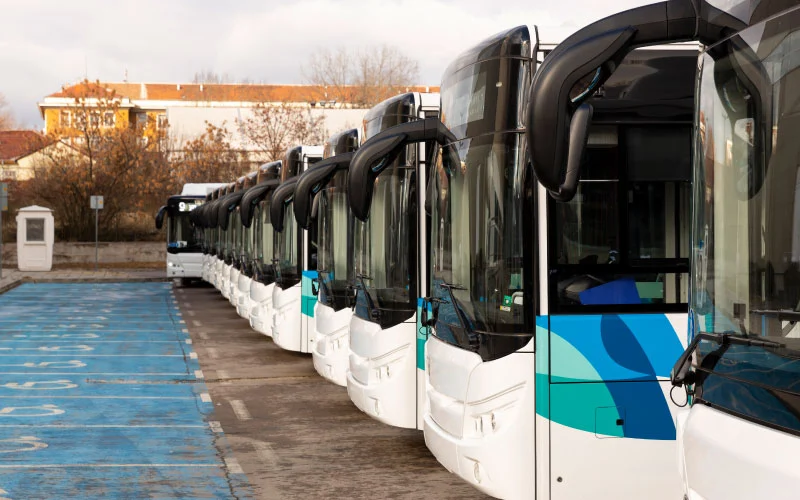 Modern charter bus parked outside corporate office in Birmingham